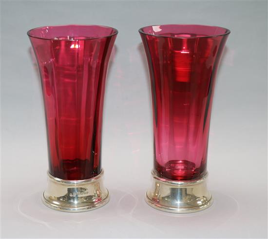 A pair of modern cranberry glass spill vases with silver bases, by J.A. Campbell, London, 2000,